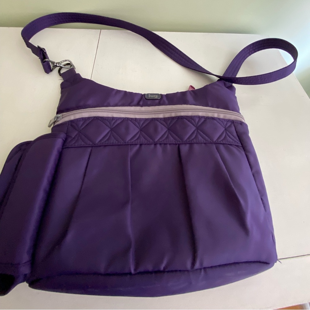 Purple Lug Swing Crossbody Purse with a water bottle holder. Perfect for travel!